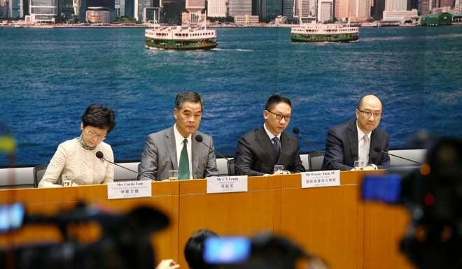 Hong Kong leader Leung Chun-ying (second from left) discusses the ruling from Beijing. Photo: Dickson Lee