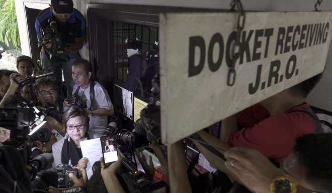 Senator Leila de Lima (C-L) files the petition at the Supreme Court in Manila. Photo: EPA