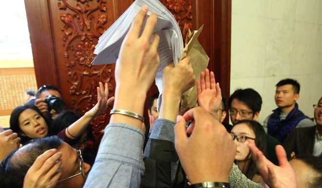 Members of the media in Beijing as the ruling was distributed today in the Great Hall of the People. Photo: Simon Song