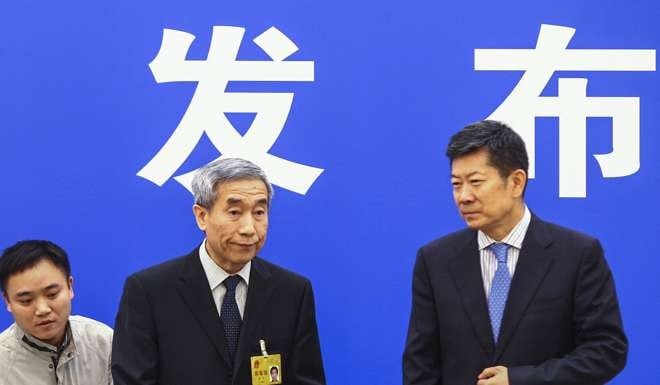 Basic Law Committee chairman Li Fei (wearing identification) explained the ruling this morning at a press conference in Beijing. Photo: Simon Song