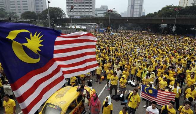 Malaysian protesters during a Bersih (The Coalition for Free and Fair Elections) rally in Kuala Lumpur on August 30 last year, to step up pressure on Prime Minister Najib Razak to resign over alleged corruption and mismanagement of debt-ridden state investor 1Malaysia Development Berhad (1MDB). Photo: EPA