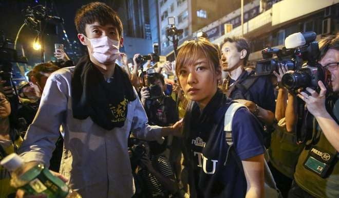 Sixtus Baggio Leung Chung-hang and Yau Wai-ching outside the central government’s liaison office early Monday. Photo: Edward Wong
