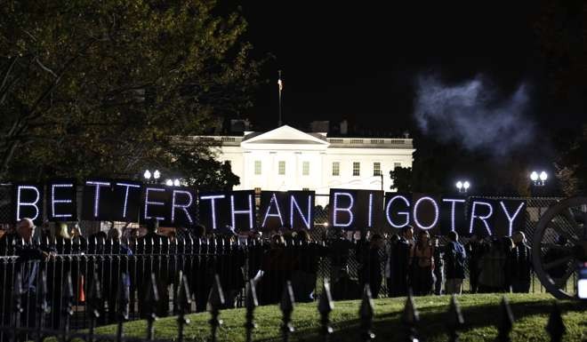 Anti Trump protesters gather outside the White House in Washington to wait for the results of the US presidential election. Photo: AFP