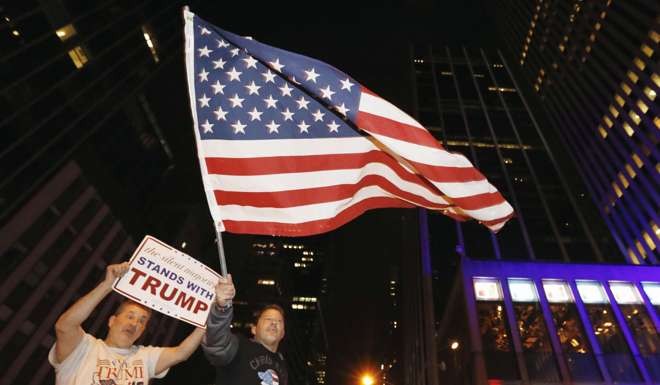 Supporters of Republican presidential candidate Donald Trump celebrate in New York. Photo: Kyodo
