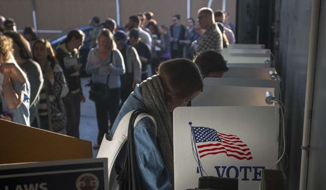 People vote at the Los Angeles Lifeguard station at Venice Beach in Los Angeles, United States. Photo: AFP
