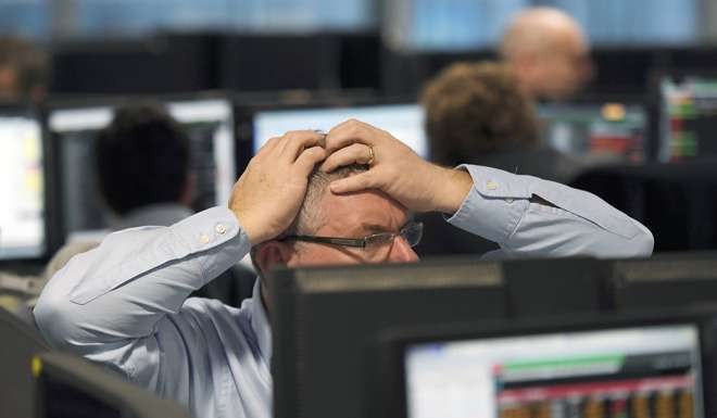 London traders grappled with huge market volatility as election results trickled in. Photo: Reuters