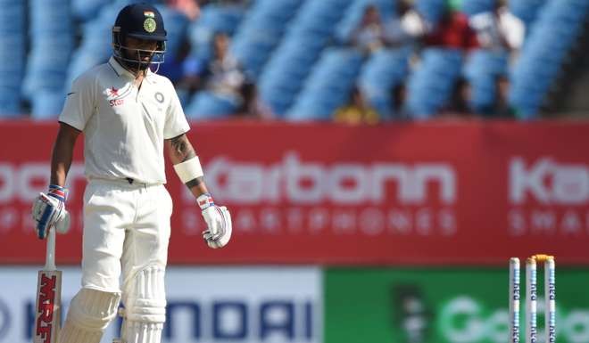 India captain Virat Kohli was out to a freak dismissal, with his back leg hitting the stumps and dislodging a bail as he tried to pull away a short delivery. Photo: AFP