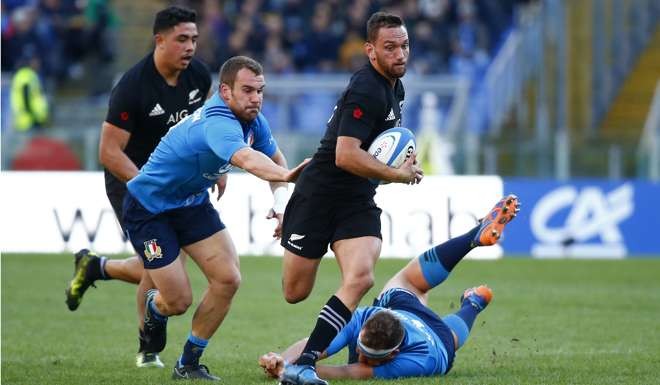 New Zealand's Aaron Cruden in action with Italy's Andrea Lovotti. Photo: Reuters