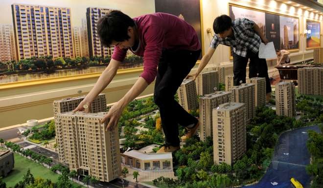 Sales of land for property development have fallen this year compared with last year after more than 20 cities announced tightening measures to curb home purchases and property speculation. Photo: Reuters