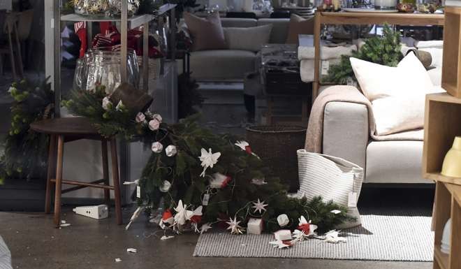 A Christmas tree lies on its side in a shop in Wellington after the quake. Photo: AP
