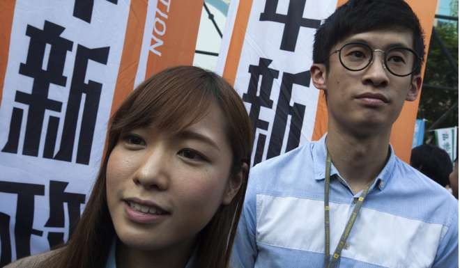 The Standing Committee ruling is likely to mean Youngspiration lawmakers Baggio Leung Chung-hang (right) and Yau Wai-ching will be kicked out of the legislature. Photo: EPA