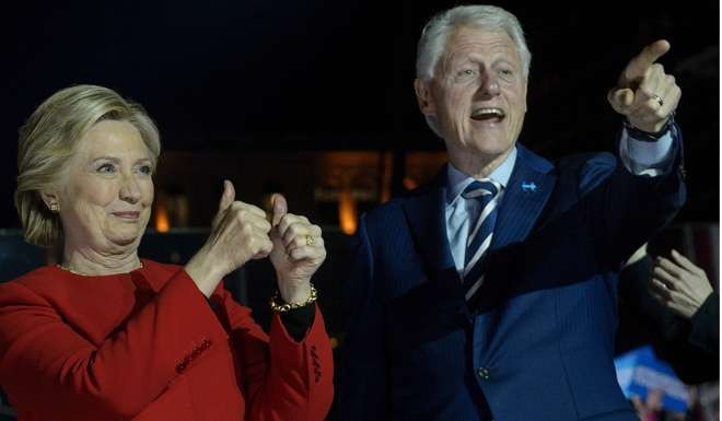 Democratic presidential nominee Hillary Clinton attends a rally in Philadelphia, Pennsylvania, with her husband, former president Bill Clinton, on the eve of the election this month. Leaders of the Democratic Party have become fabulously rich by selling influence to rich people. Photo: AFP