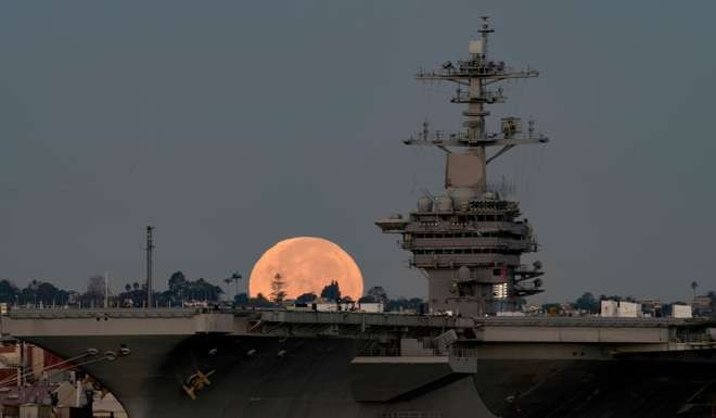 The aircraft carrier USS Theodore Roosevelt is moored in Coronado, California. America’s global military dominance, especially in East Asia where most global production and savings take place, is a pillar for its prosperity. Photo: AFP/US Navy