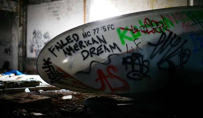 A boat covered in graffiti lies inside an abandoned and decaying manufacturing plant for an auto company in Detroit, in 2011. Trump is likely to do something quickly to show his determination to help blue-collar workers. Photo: Reuters