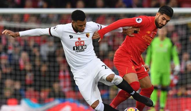 Watford's Etienne Capoue (left) vies with Liverpool's Emre Can in the Premier League earlier this month. Photo: AFP