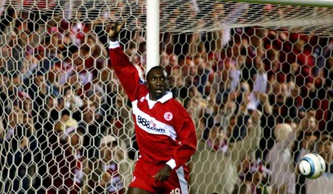 Jimmy Floyd Hasselbaink celebrates scoring while playing for Middlesbrough in 2004. Photo: AFP