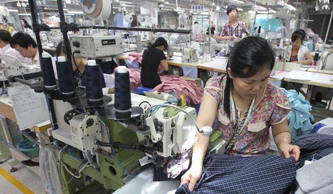 Workers at a garment manufacturer in Dongguan, Guangdong Province. To qualify for pensions, Chinese workers must have made social security payments for at least 15 years. Photo: SCMP Pictures