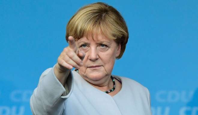 German Chancellor Angela Merkel pointing during an electoral meeting of the Christian Democtaric Union party. Photo: AFP