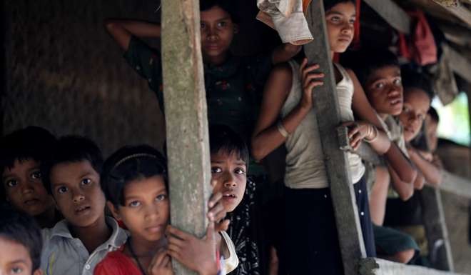 Rohingya Muslim children stand in U Shey Kya village outside Maungdaw in Rakhine state. Photo: Reuters