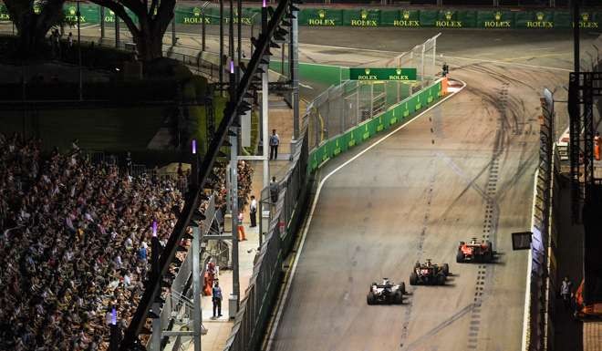 Drivers drive during the Formula One Singapore Grand Prix in September. The floodlit night race in Marina Bay is one of the highlights of the F1 calendar. Photo: AFP