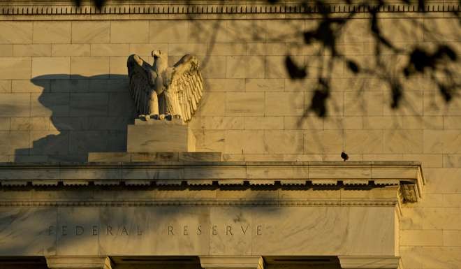 An eagle sculpture stands on the facade of the Federal Reserve building in Washington, DC. Photo: Bloomberg