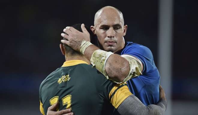 Italy's Sergio Parisse, right, embraces South Africa's Bryan Habana at the end of the international rugby union test match between Italy and South Africa, in Florence, Italy. Photo: AP