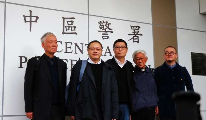Occupy Central co-founders (from left) Reverend Chu Yiu-ming, Benny Tai and Chan Kin-man, former head of the Catholic Church in Hong Kong Cardinal Joseph Zen Ze-kiun and social worker Shiu Ka-chun outside Central Police Station after turning themselves into the police, in a still from Evans Chan’s documentary. Photo: P. H. Yang