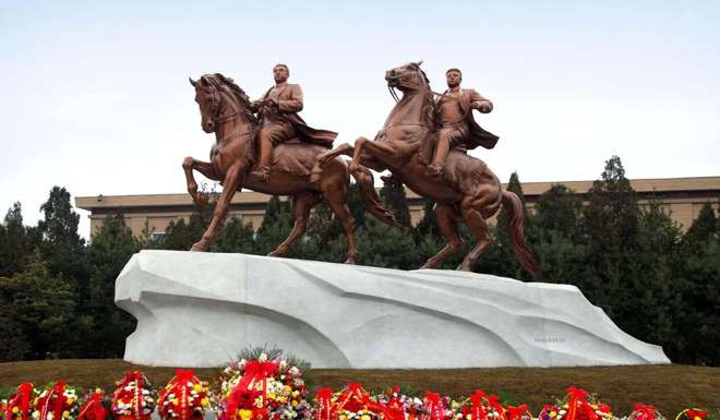 Statues of former North Korean President Kim Il-sung, left, and Kim Jong-il at the Mansudae in Pyongyang. Photo: AFP