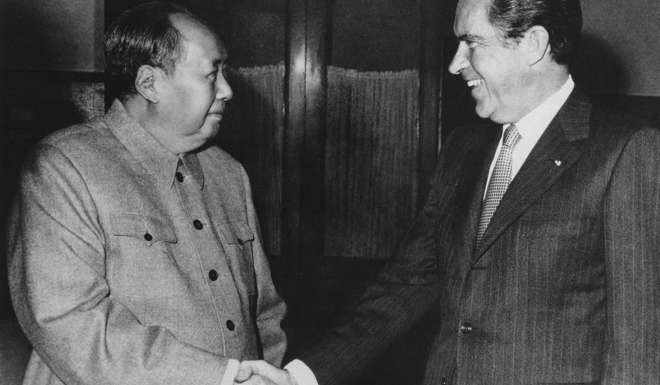 Chairman Mao Zedong greets US president Richard Nixon in Beijing on February 21, 1972. Photo: AP