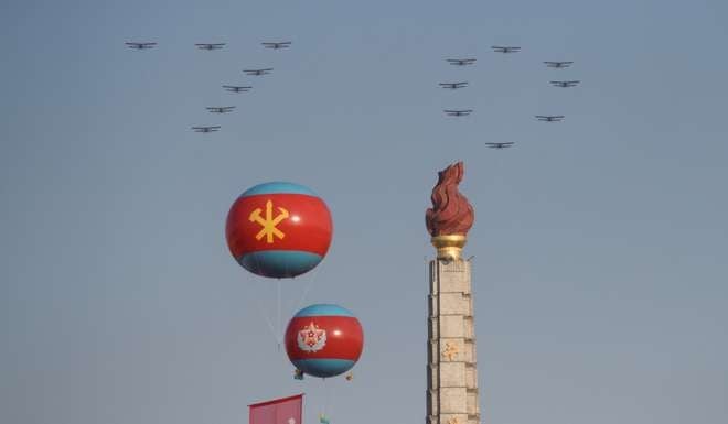 Aircraft perform a fly past over the Juche tower at Kim Il-Sung square in Pyongyang to mark the 70th anniversary of North Korea’s ruling Workers’ Party. Photo: AFP