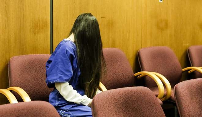 Yang Yuhan waits for a bailiff after her sentencing in February at Pomona Superior Court. Photo: Los Angeles Times