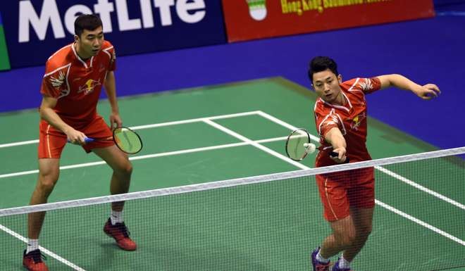 China’s Chai Biao (right) and Hong Wei on their way to victory against Hong Kong’s Law Cheuk-him and Lee Chun-hei. Photo: Xinhua