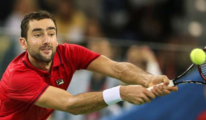 Croatia's Marin Cilic fires a backhand in his match against Argentina's Federico Delbonis. Photo: Reuters