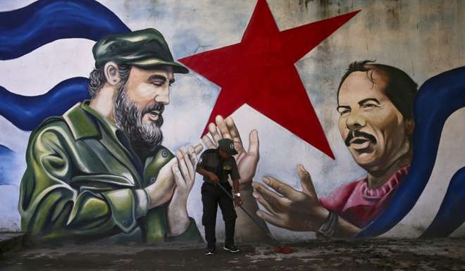 The Cuba Plaza mural depicting President Fidel Castro and Nicaragua’s Daniel Ortega. Photo: AP