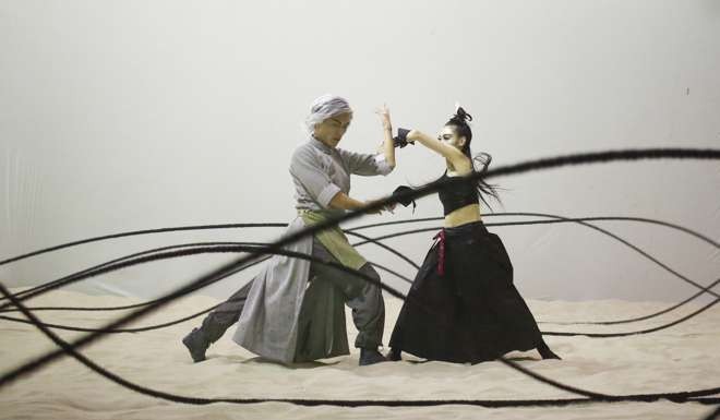 Huang Lei (left) as Wah Ying-hung and Pan Lingjuan as Wah Man-ying/King-tin in a scene from Hong Kong Dance Company's adaptation of Chinese Hero: A Lone Exile.