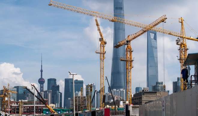 Building cranes have become a rare site in cities such as Shanghai as the economy enters prolonged slowdown. Photo: AP