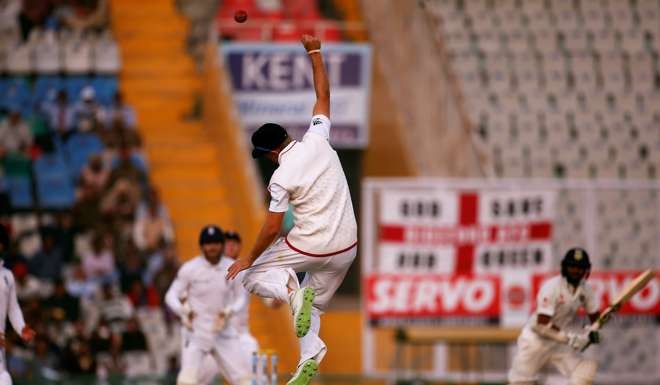 England's Joe Root leaps in the air to stop the ball. Photo: Reuters