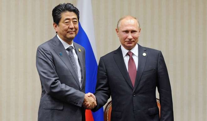 Japanese Prime Minister Shinzo Abe meets Russian President Vladimir Putin on the sidelines of the recent Asia-Pacific Economic Cooperation (Apec) leaders' meeting in Lima. File photo: AFP