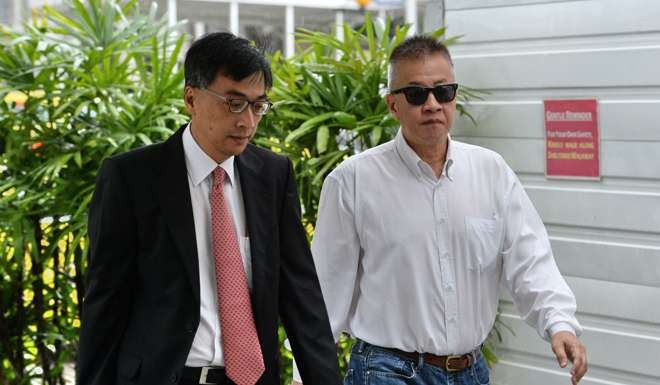 Yak Yew Chee (right), a former managing director of the Singapore branch of Swiss bank BSI, who was jailed on fraud charges relating to the 1MDB financial scandal last month. Photo: AFP