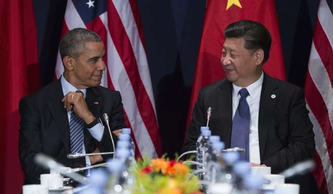 US President Barack Obama and Chinese President Xi Jinping in Le Bourget, outside Paris, in November last year. Photo: AP