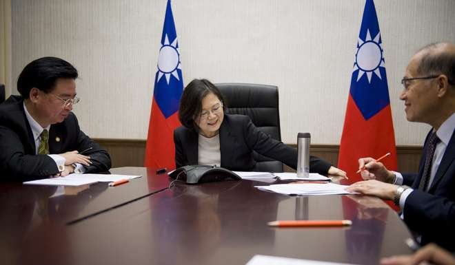 A handout picture released by the Office of the President Taiwan shows Taiwanese President Tsai Ing-wen having a phone conversation with US President-elect Donald Trump. Photo: EPA