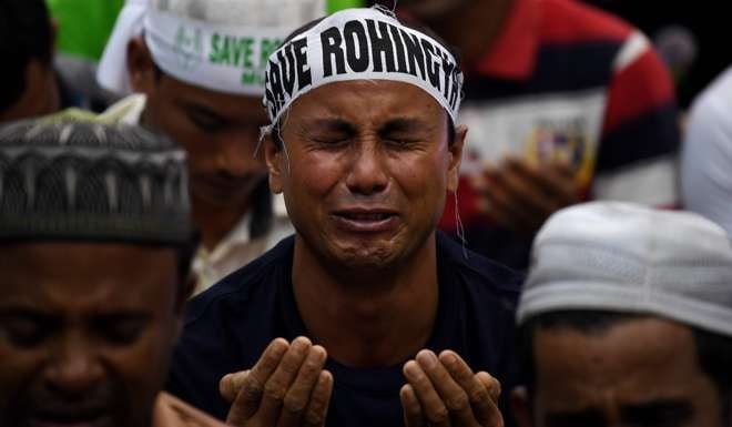 An ethnic Rohingya Muslim refugee breaks down during the gathering in Kuala Lumpur. Photo: AFP