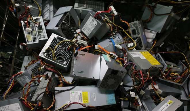 Companies are being urged to collects old equipment from companies and recycle as much as possible. Photo: AFP