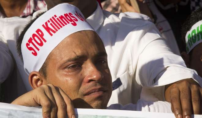 A Rohingya Muslim living in Malaysia cries during the protest. Photo: AP