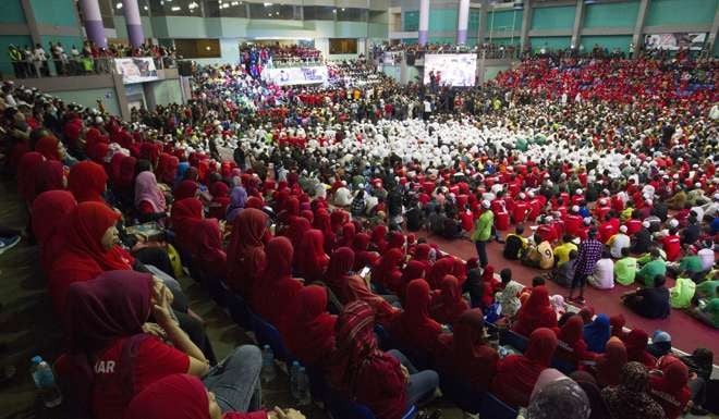 Thousands of Malaysian Muslims gather to protest against Myanmar’s government at a stadium in Kuala Lumpur. Photo: AP