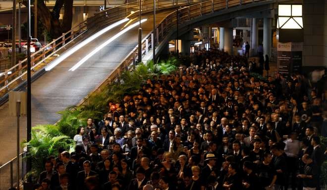 Hundreds of Hong Kong lawyers wearing black walk in silence to the Court of Final Appeal in protest against Beijing’s interpretation of the Basic Law, on November 8. Photo: Reuters