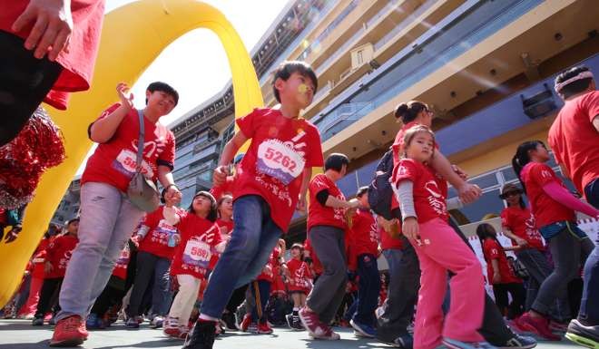 Participants compete during Kidathon 2016 organised by McDonald's at Happy Valley Racecourse. Photo: David Wong