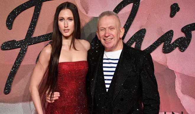 Model Anna Cleveland van Ravenstein and designer Jean Paul Gaultier arrive for the awards ceremony. Photo: EPA