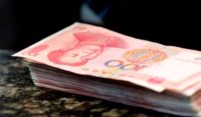 The number of yuan remittances at the Hong Kong branch of two mainland banks doubled in November. Photo: Reuters