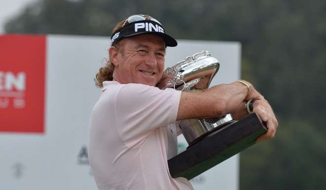 Miguel Angel Jimenez with the Hong Kong Open trophy in December 2013. Photo: Richard Castka/Sportpixgolf.com